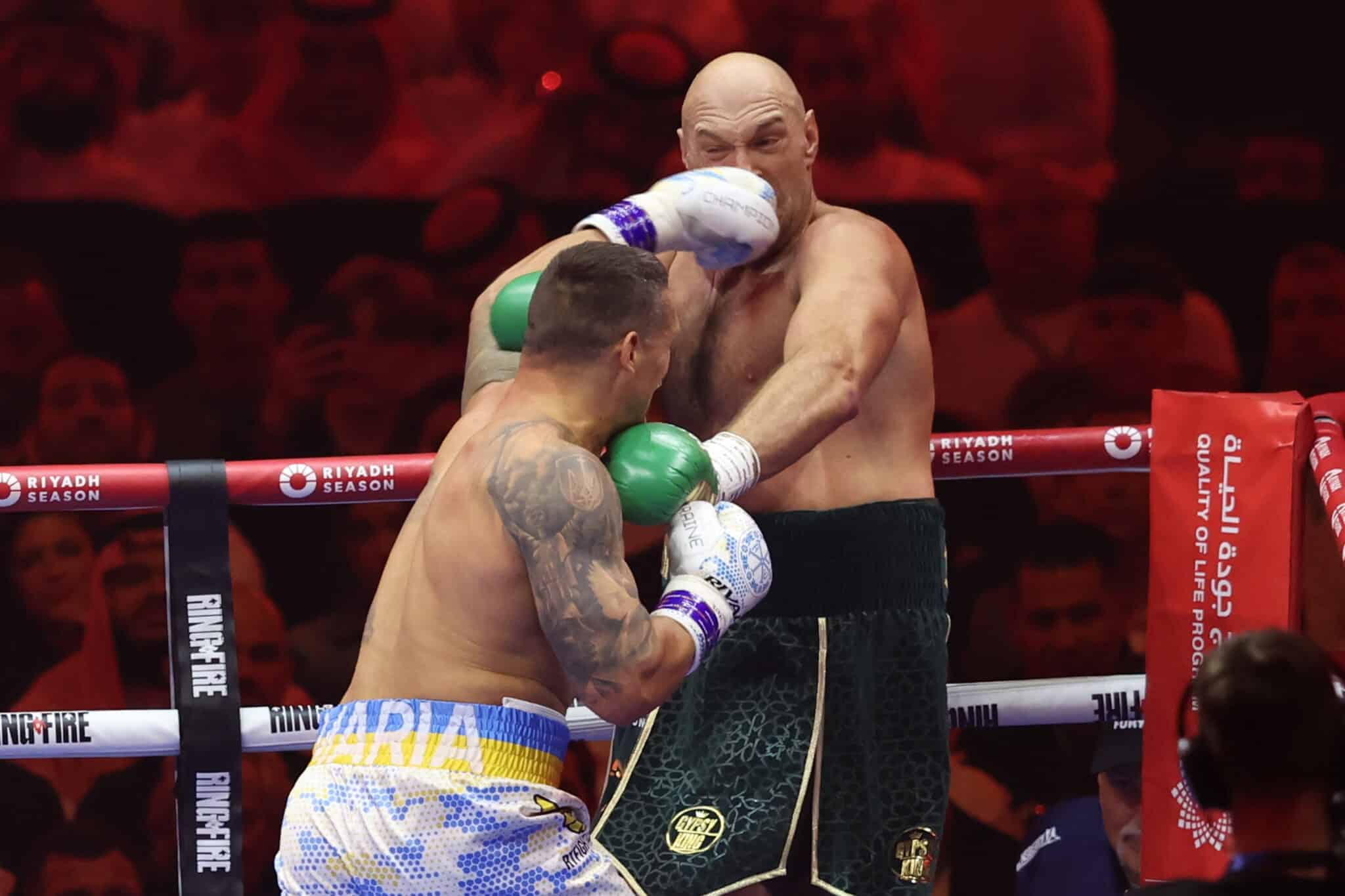 Tyson Fury dodging a punch from Oleksandr Usyk during their heavyweight boxing rematch.